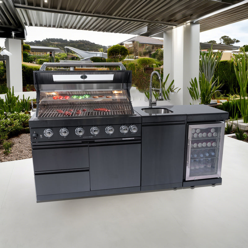 Black stainless steel outdoor kitchen installed on modern patio with grill and sink.